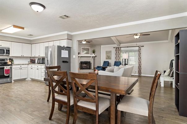 Dining room, Fireplace, Interior, Kitchen, Living room, Stainless Steel Appliances, Wood Texture Flooring