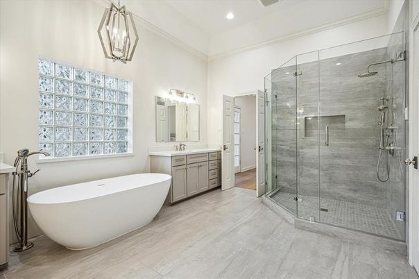 Bathroom, Dual Sink Vanities, Free Standing Baths, Glass Shower, Interior, Pendant Lights, Recessed Lighting, Wood Texture Flooring