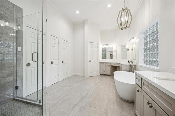 Bathroom, Dual Sink Vanities, Free Standing Baths, Glass Shower, Interior, Pendant Lights, Recessed Lighting, Wood Texture Flooring