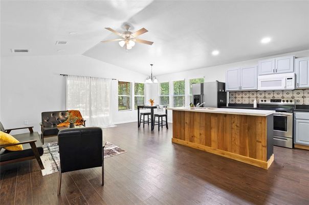 Dining room, Interior, Kitchen, Living room, Pendant Lights, Recessed Lighting, Stainless Steel Appliances, Wood Texture Flooring