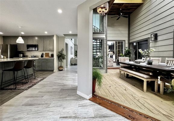 Chandelier, Dining room, Interior, Kitchen, Marble, Pendant Lights, Recessed Lighting, Stainless Steel Appliances, Wood Texture Flooring