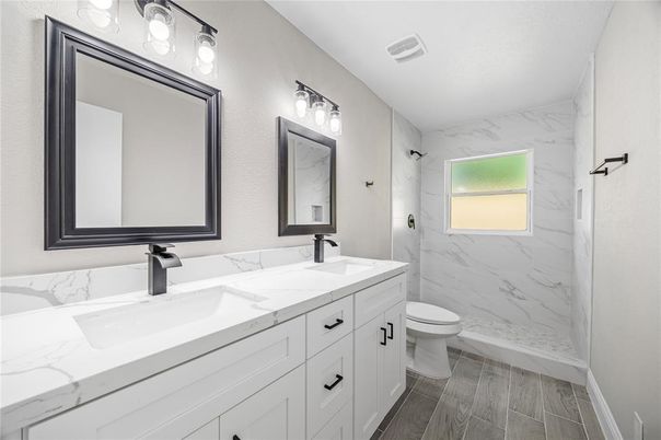 Bathroom, Dual Sink Vanities, Interior, Marble Walls, Wood Texture Flooring