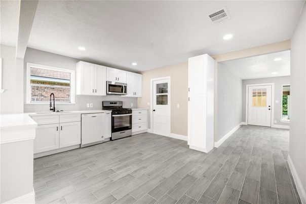 Interior, Kitchen, Recessed Lighting, Stainless Steel Appliances, Wood Texture Flooring