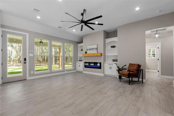 Empty room, Fireplace, Interior, Pendant Lights, Recessed Lighting, Wood Texture Flooring