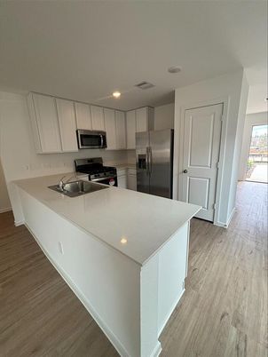 Interior, Kitchen, Recessed Lighting, Stainless Steel Appliances, Wood Texture Flooring