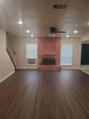 Empty room, Fireplace, Interior, Recessed Lighting, Stone Walls, Wood Texture Flooring