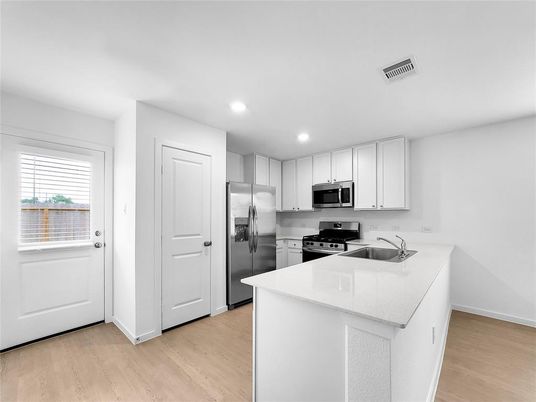 Interior, Kitchen, Recessed Lighting, Stainless Steel Appliances, Wood Texture Flooring