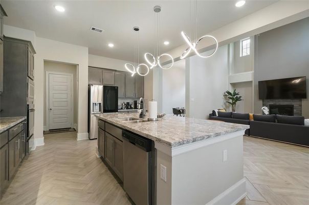 Fireplace, Interior, Kitchen, Living room, Pendant Lights, Recessed Lighting, Stainless Steel Appliances, Wood Texture Flooring