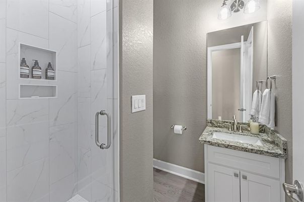 Bathroom, Glass Shower, Interior, Marble Walls, Wood Texture Flooring