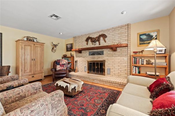 Fireplace, Interior, Living room, Recessed Lighting, Stone Walls, Wood Texture Flooring