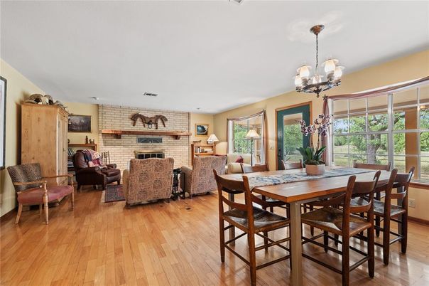 Chandelier, Dining room, Fireplace, Interior, Living room, Stone Walls, Wood Texture Flooring