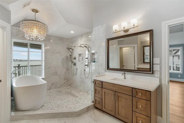 Bathroom, Chandelier, Dual Sink Vanities, Free Standing Baths, Glass Shower, Interior, Marble, Marble Walls, Recessed Lighting, Wood Texture Flooring