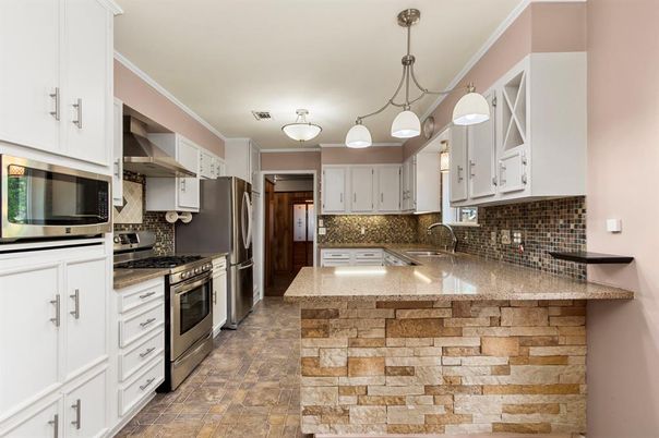 Interior, Kitchen, Pendant Lights, Stainless Steel Appliances, Stone Walls