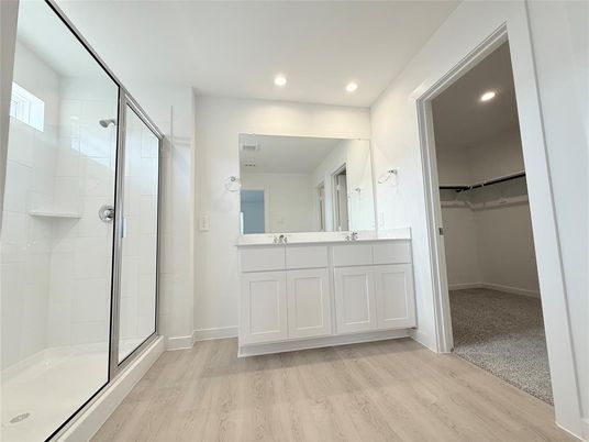 Bathroom, Dual Sink Vanities, Glass Shower, Interior, Recessed Lighting, Walk-in Closets, Wood Texture Flooring