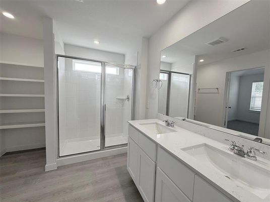 Bathroom, Dual Sink Vanities, Glass Shower, Interior, Recessed Lighting, Wood Texture Flooring