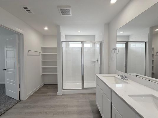 Bathroom, Dual Sink Vanities, Glass Shower, Interior, Recessed Lighting, Walk-in Closets, Wood Texture Flooring