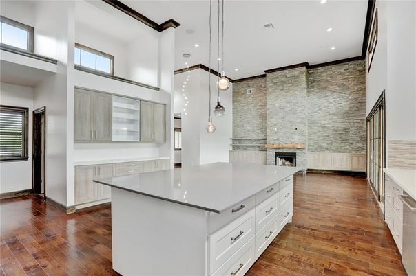 Fireplace, Interior, Kitchen, Pendant Lights, Recessed Lighting, Stone Walls, Wood Texture Flooring