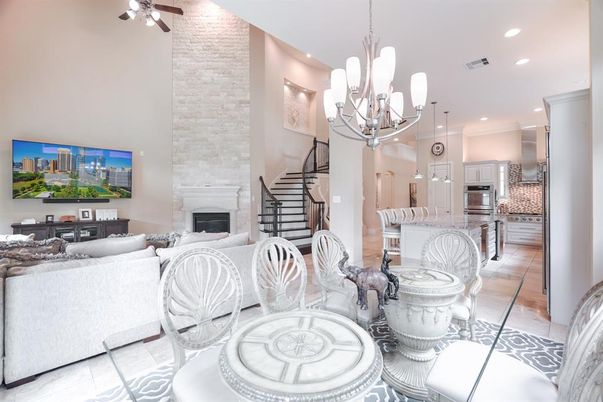 Chandelier, Dining room, Fireplace, Interior, Kitchen, Living room, Recessed Lighting, Stainless Steel Appliances, Stone Walls
