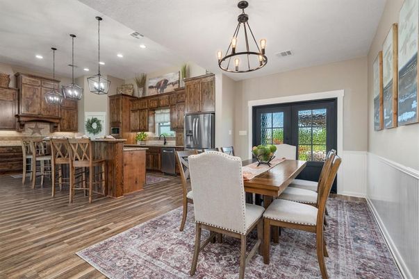 Chandelier, Dining room, Interior, Kitchen, Pendant Lights, Recessed Lighting, Stainless Steel Appliances, Wood Texture Flooring