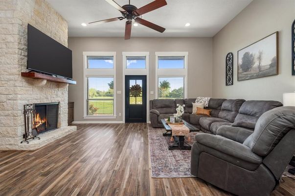 Fireplace, Interior, Living room, Recessed Lighting, Stone Walls, Wood Texture Flooring