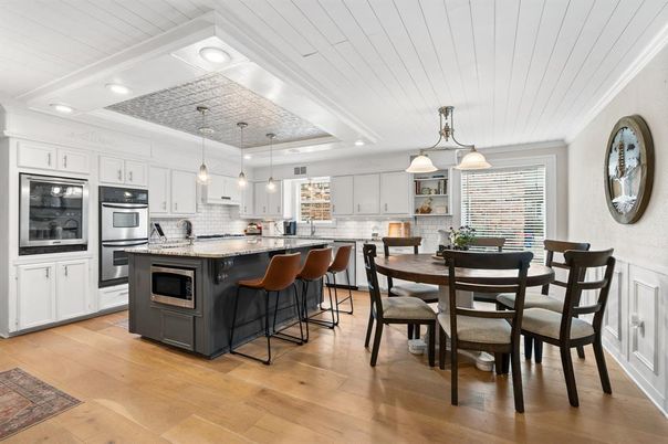 Dining room, Interior, Kitchen, Pendant Lights, Recessed Lighting, Stainless Steel Appliances, Wood Texture Flooring