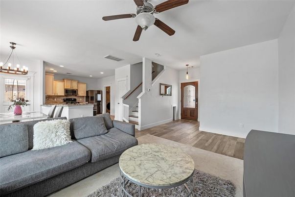 Chandelier, Interior, Kitchen, Living room, Pendant Lights, Recessed Lighting, Stainless Steel Appliances, Wood Texture Flooring