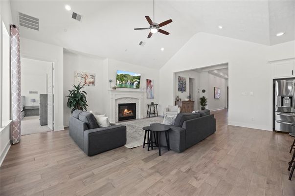 Fireplace, Interior, Kitchen, Living room, Recessed Lighting, Stainless Steel Appliances, Wood Texture Flooring