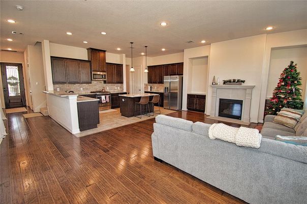 Dining room, Fireplace, Interior, Kitchen, Living room, Pendant Lights, Recessed Lighting, Stainless Steel Appliances, Wood Texture Flooring