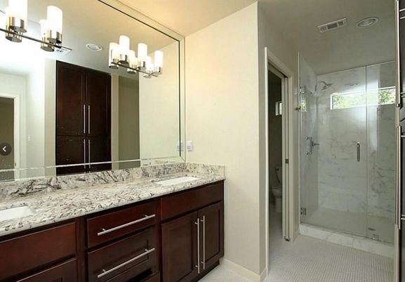 Bathroom, Dual Sink Vanities, Glass Shower, Interior, Marble Walls, Recessed Lighting