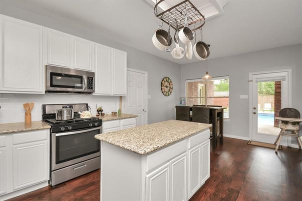 Dining room, Interior, Kitchen, Pendant Lights, Stainless Steel Appliances, Wood Texture Flooring