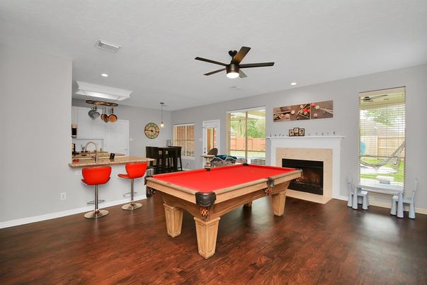 Billiard Table, Fireplace, Game Room, Interior, Pendant Lights, Recessed Lighting, Wood Texture Flooring