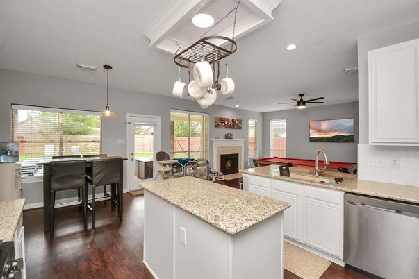Dining room, Fireplace, Interior, Kitchen, Pendant Lights, Recessed Lighting, Wood Texture Flooring