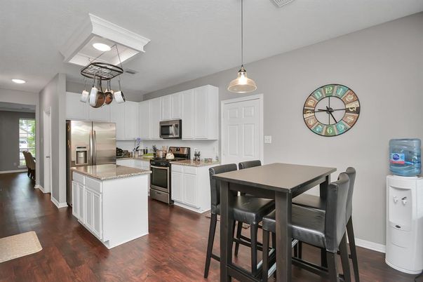 Dining room, Interior, Kitchen, Pendant Lights, Recessed Lighting, Stainless Steel Appliances, Wood Texture Flooring