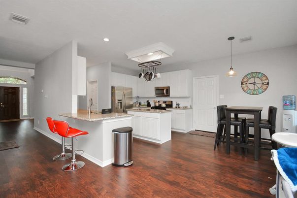 Dining room, Interior, Kitchen, Pendant Lights, Recessed Lighting, Stainless Steel Appliances, Wood Texture Flooring