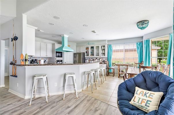 Dining room, Interior, Kitchen, Recessed Lighting, Stainless Steel Appliances, Wood Texture Flooring