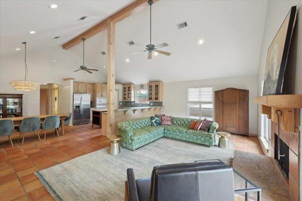 Chandelier, Dining room, Fireplace, Interior, Kitchen, Living room, Pendant Lights, Recessed Lighting, Stainless Steel Appliances, Wooden Beams