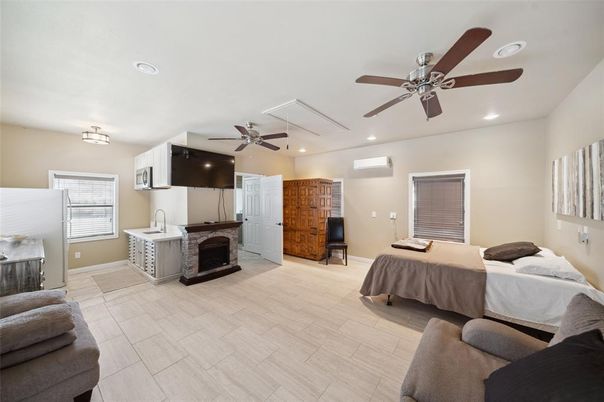 Bedroom, Fireplace, Interior, Recessed Lighting, Wood Texture Flooring