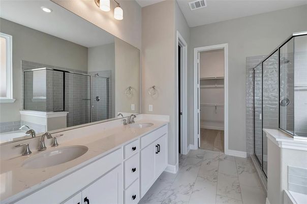 Bathroom, Dual Sink Vanities, Glass Shower, Interior, Marble, Recessed Lighting, Walk-in Closets