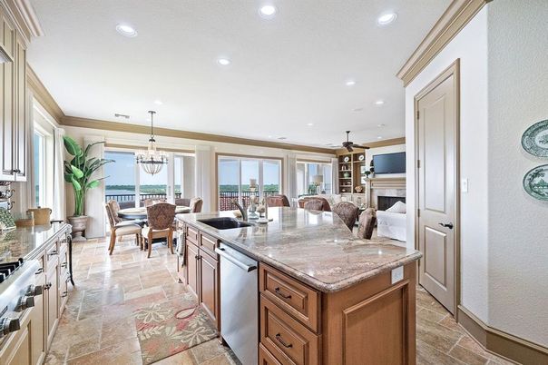 Chandelier, Dining room, Fireplace, Interior, Kitchen, Living room, Recessed Lighting, Stainless Steel Appliances