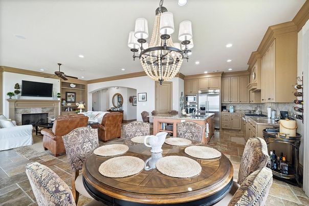 Chandelier, Dining room, Fireplace, Interior, Kitchen, Living room, Recessed Lighting, Stainless Steel Appliances