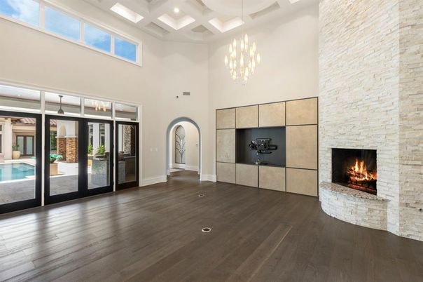 Chandelier, Fireplace, Interior, Pendant Lights, Recessed Lighting, Stone Walls, Wood Texture Flooring