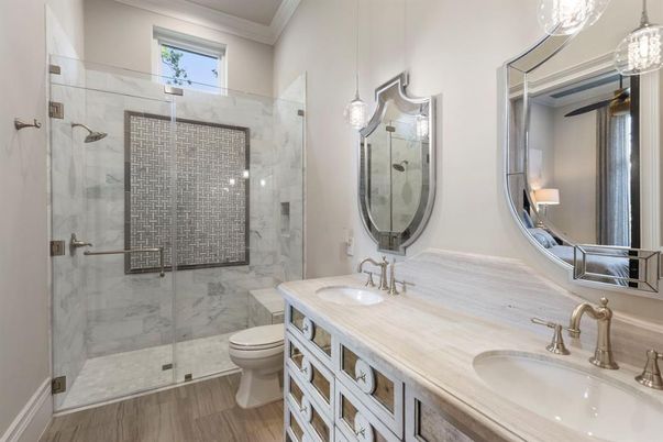 Bathroom, Dual Sink Vanities, Glass Shower, Interior, Marble Walls, Wood Texture Flooring
