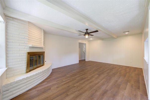 Empty room, Fireplace, Interior, Recessed Lighting, Stone Walls, Wood Texture Flooring