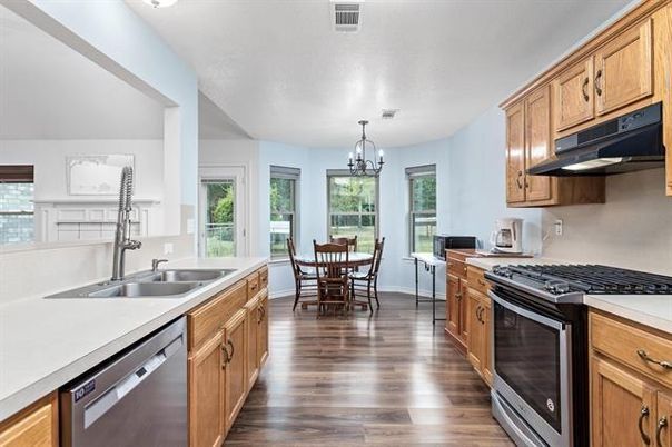 Chandelier, Dining room, Interior, Kitchen, Stainless Steel Appliances, Wood Texture Flooring