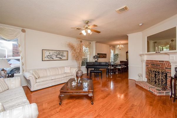 Chandelier, Dining room, Fireplace, Interior, Living room, Piano, Wood Texture Flooring