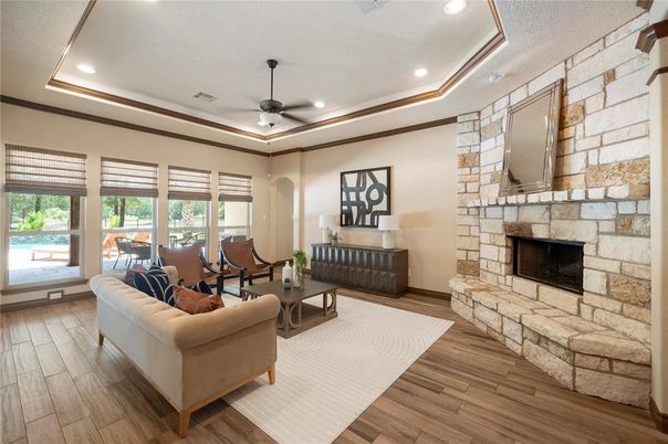 Fireplace, Interior, Living room, Recessed Lighting, Stone Walls, Wood Texture Flooring