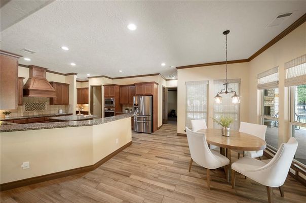 Dining room, Interior, Kitchen, Pendant Lights, Recessed Lighting, Stainless Steel Appliances, Wood Texture Flooring