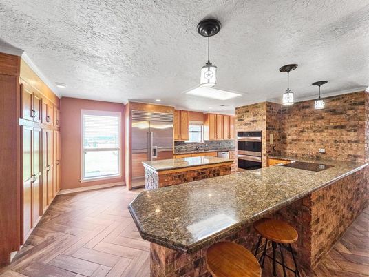 Interior, Kitchen, Pendant Lights, Recessed Lighting, Stainless Steel Appliances, Stone Walls, Wood Texture Flooring