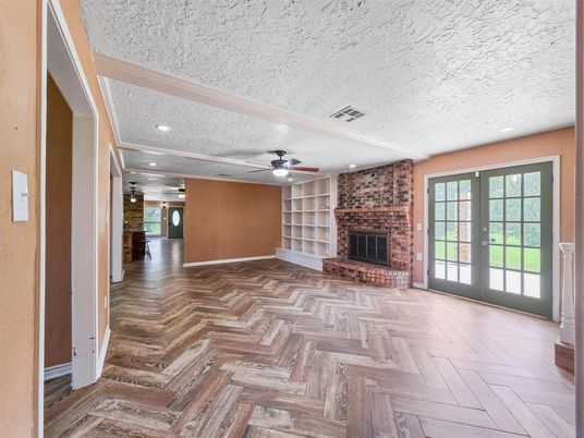 Empty room, Fireplace, Interior, Recessed Lighting, Stone Walls, Wood Texture Flooring