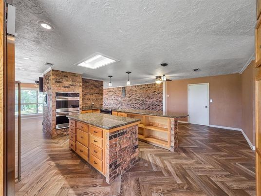 Interior, Kitchen, Pendant Lights, Recessed Lighting, Stainless Steel Appliances, Stone Walls, Wood Texture Flooring